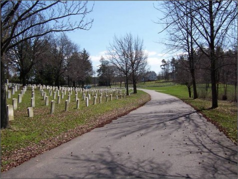 Road through Hartford Soldiers’ Field with rows of veteran grave markers